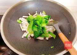Illustration of how to stir-fry rapeseed with white jade mushrooms 9