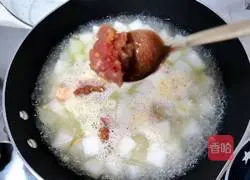 Illustration of how to make salted egg and winter melon meatball soup 6