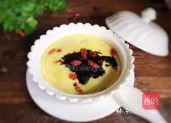 Illustration of how to make steamed eggs with longan and wolfberry 11