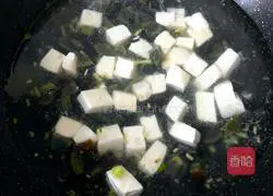 Illustration of how to make preserved egg and tofu soup 9