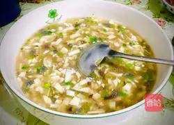 Illustration of how to make preserved egg and tofu soup 8