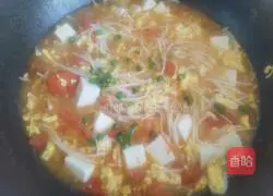 Illustration of how to make tomato and enoki mushroom tofu soup 12