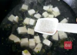 Illustration of how to make preserved egg and tofu soup 10
