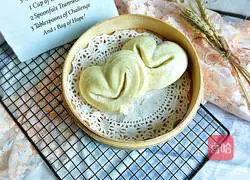 Illustration of how to make heart-shaped white steamed buns 17