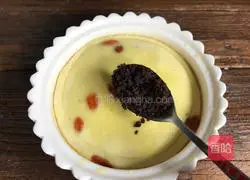 Illustration of how to make steamed eggs with longan and wolfberry 10