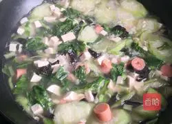Illustration of how to make loofah tofu soup 10