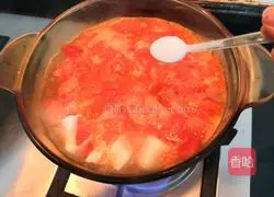 Illustration of how to make tomato and enoki mushroom tofu soup 13