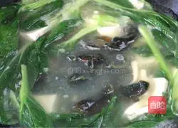 Illustration of how to make preserved egg and tofu soup 10