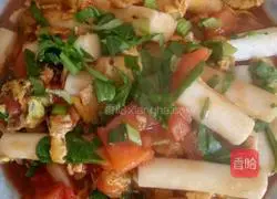 Illustration of how to make fried rice cakes with tomatoes and eggs 4