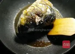 Braised fish head and braised tofu Illustration of how to do it 4