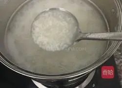 Preserved egg and lean meat porridge.Illustration of how to make it 3