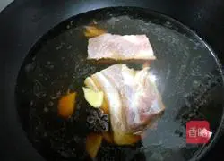 Illustration of how to make braised pork with tea and plum vegetables 3