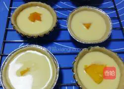 Illustration of how to make homemade mango egg tart with egg tart crust 10
