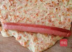 Illustration of how to roll ham sausage with carrot and egg pancake 8