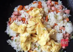 Illustration of how to make sausage, carrot and egg fried rice 9