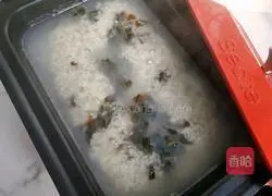 Illustration of how to make preserved egg and lean meat porridge 9