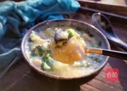 Illustration of how to make cabbage, frozen tofu and preserved egg porridge 11