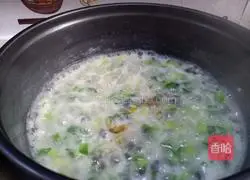 Illustration of how to make preserved egg and vegetable porridge 11