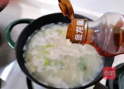 Illustration of how to make preserved egg and vegetable porridge 7