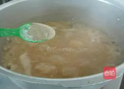 Illustration of how to make lean meat porridge 7